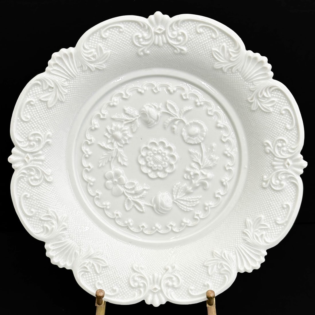Meissen Germany Molded Floral 8.1 inch Porcelain Plate c1900: Meissen Germany Molded Porcelain Plate, circa 1900. Raised floral decoration, a scalloped rim. Underside with Meissen crossed swords mark. Weight: Approx. 1 lb Measurements: approx. 8.125 inches diame
