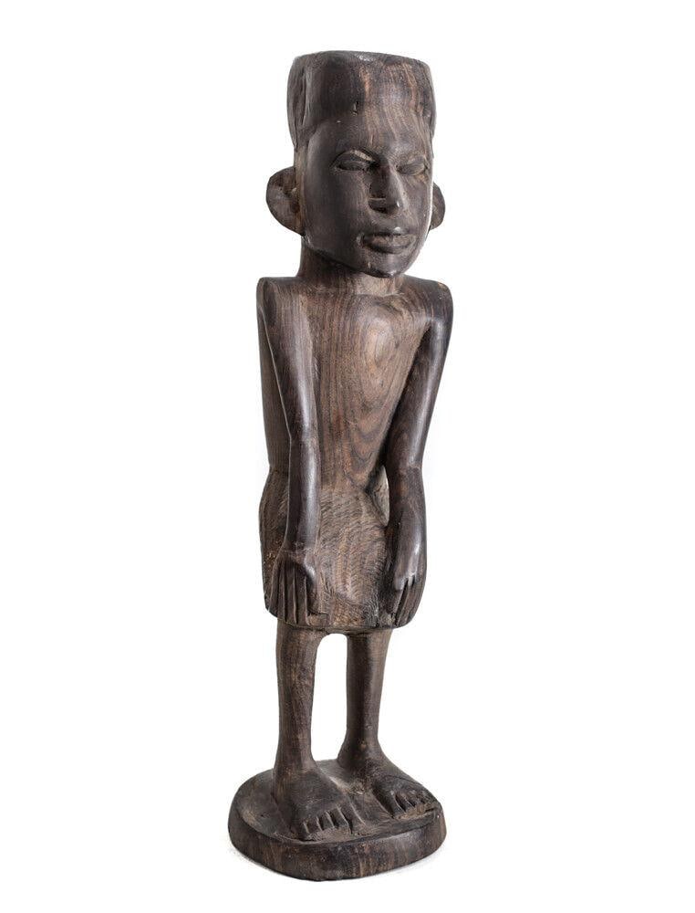 African Hardwood figure Man knees bent hands on bent knees: African Hardwood figure, Man knees bent, hands on bent knees. In shorter skirt-like wrap. Realistic facial features. Heavy for size. 3.5lbs Measurements: Approx. 14.375" height. Condition: Condition c
