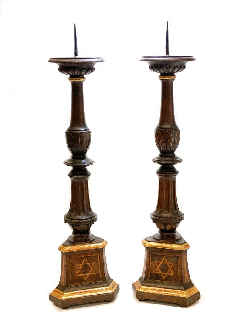 Continental Inlaid Wood Sabbath Candlesticsk Holders with Star of David Judaica: A pair of Continental Judaica wooden candlestick holder pricks, 19th Century. Hand carved leaves to the columns with wood inlayed marquetry Star of David to the bases. Weight: Approx. 5 lbs Measuremen