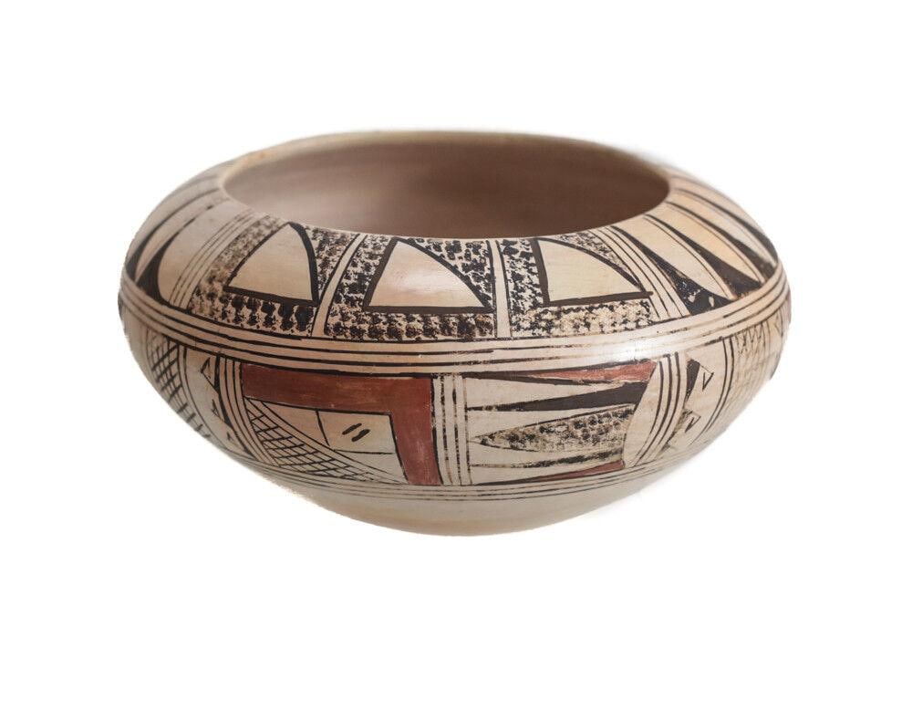 Polychrome Hopi Pottery Jar Signed M. Sakeva finely painted designs burnished: Polychrome Hopi Pottery Jar, low squat form, Signed M. Sakeva, finely painted designs, buff ground, burnished slip, designs outlined in black, filled in with red. Mid 20th century. Butterfield & Butte