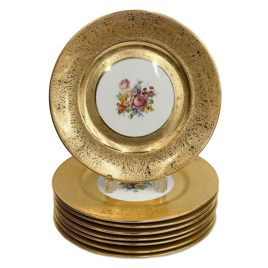 8 Bavarian Floral Gilt Porcelain Dinner Plates mid 20th cen: 8 Bavarian Gilt Porcelain Dinner Plates. Florals to center, ornate gilt decoration to rim. Underside marked Superior China Bavaria Décor Warranted 22 carat gold Weight: Approx. 14 lbs Measurements: A
