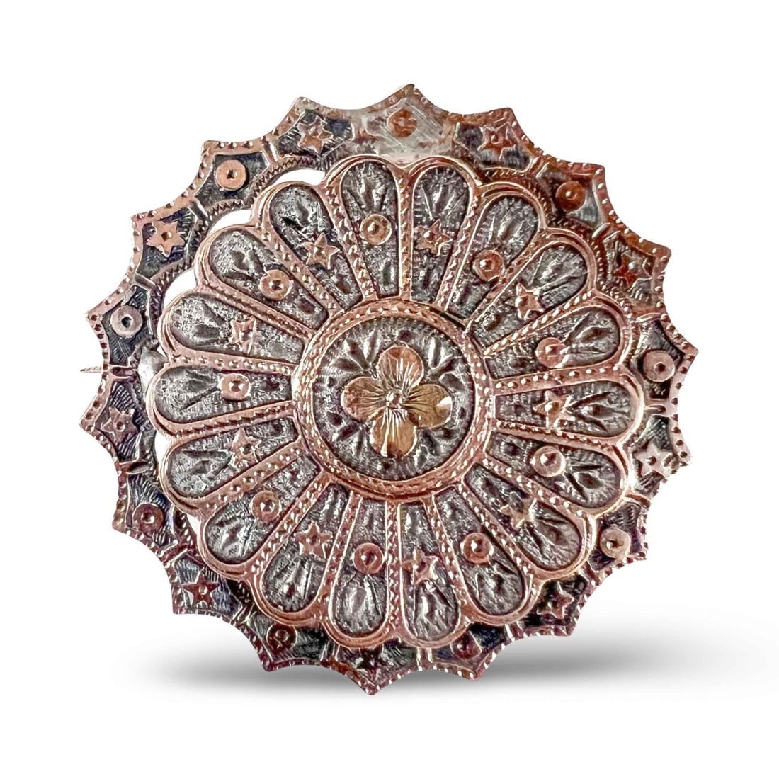 Victorian sweetheart brooch sterling silver applied rose gold accents: Victorian sweetheart brooch in silver with applied rose gold accents, unmarked tested silver and gold. Floral motif, with stars and circles, finely engraved C closure. 1880s to circa 1915. Measurement