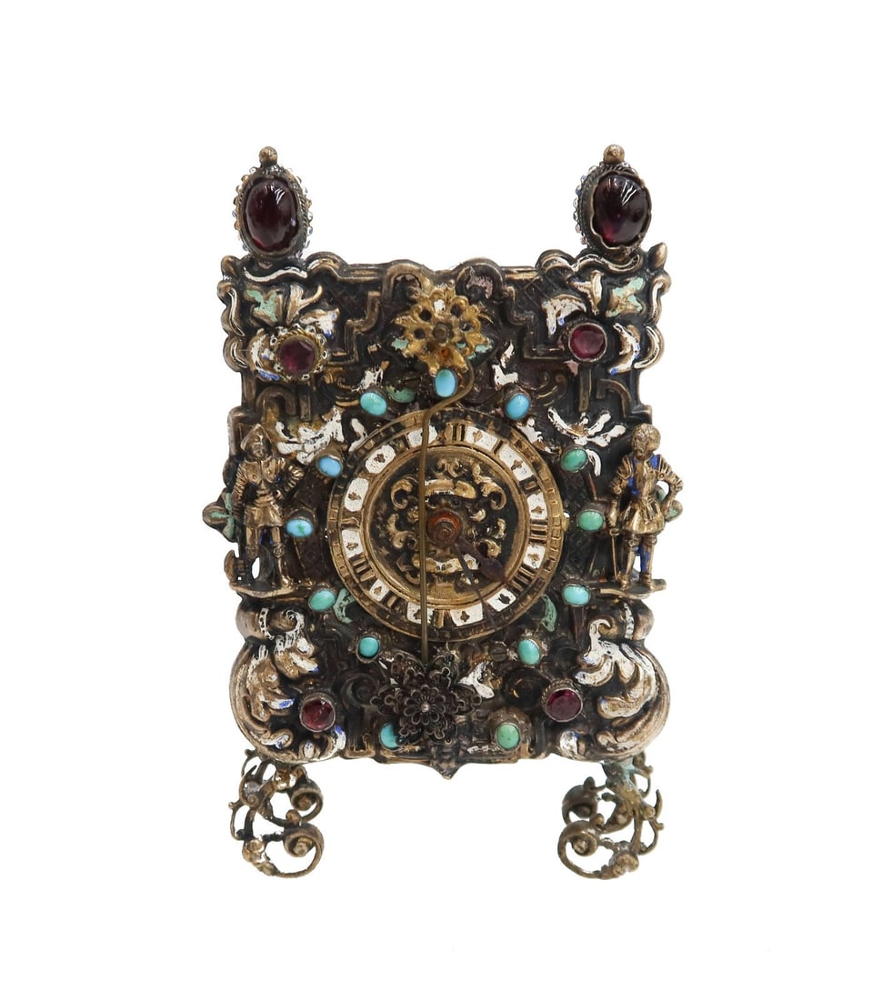 Austrian Silver Filigree Enamel and Jeweled Garnet Turquoise Footed Desk Clock: Austrian silver filigree enamel and jeweled garnet turquoise footed desk clock. Filigree texture with garnet and turquoise encrusted jewels throughout. Test for a low grade silver and comes with a key