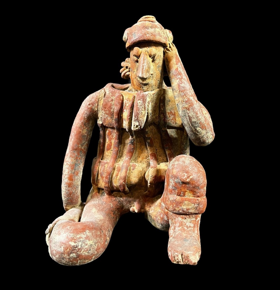 Pre Columbian COLIMA Mexico male slab figure: Pre Columbian likely COLIMA Mexico male slab figure, seated with one leg tucked under, one leg bent. Measurements: Approx. 8 inches height x 5.5 x 4.625 inches Condition: Condition commensurate with a