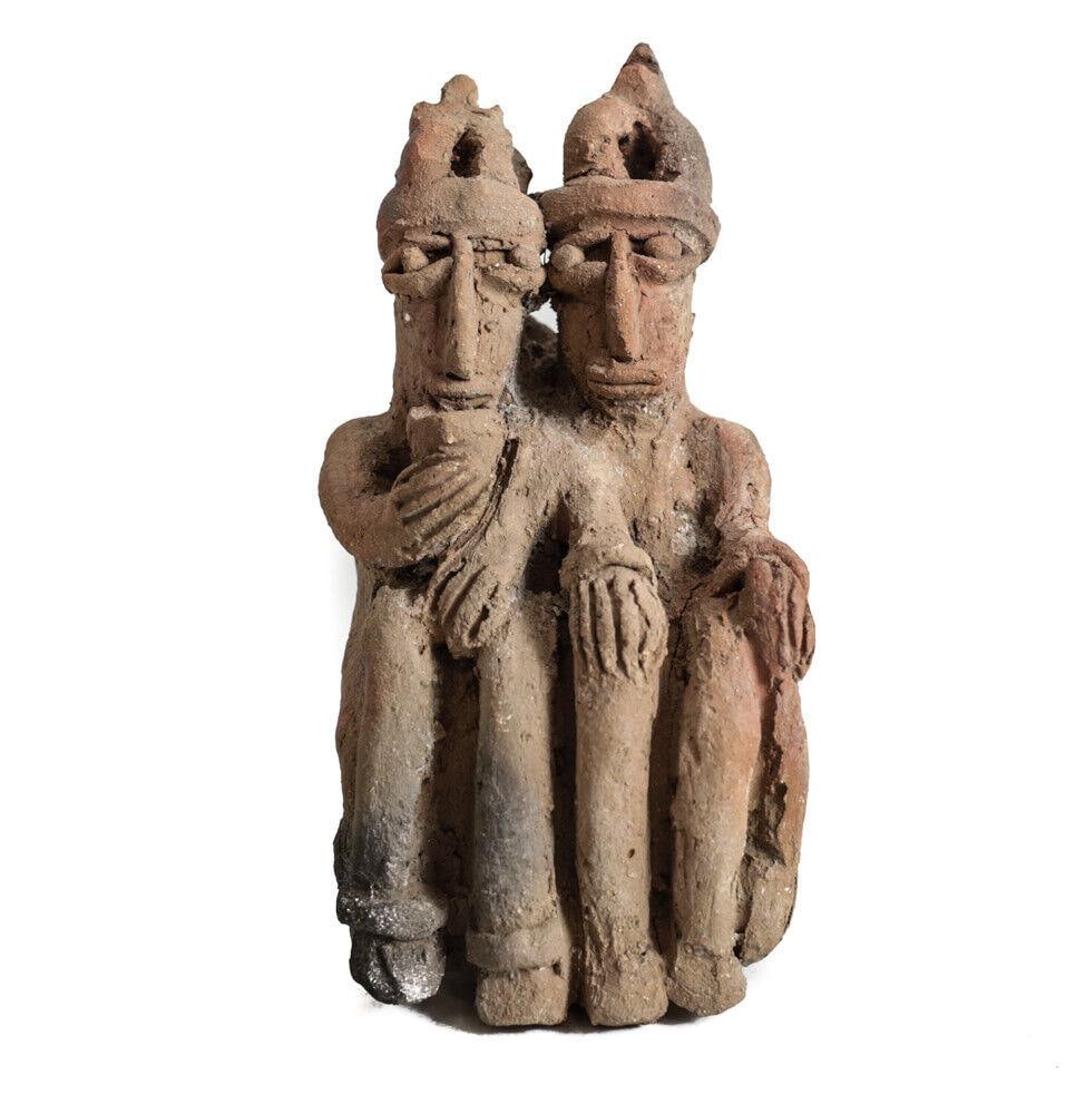 Pre Columbian Colima Conjoined Guardian figures: Pre Columbian Colima Conjoined Guardian figures, one drinking from cup, one holding a staff or club. Sash detail on back. 1lb Measurements: Approx. Solid. 5.5" height x 3" x 3". Condition: Condition c