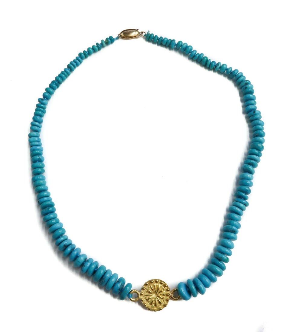 22k and 14k Yellow Gold Graduated Turquoise Beaded Necklace: 22k and 14k Yellow Gold Graduated Turquoise Beaded Necklace. Graduated turquoise measuring from 3.7mm to 8.2mm. Gold floral pendant to center testing for at least 22k and marked 14k to clasp. Weight: 