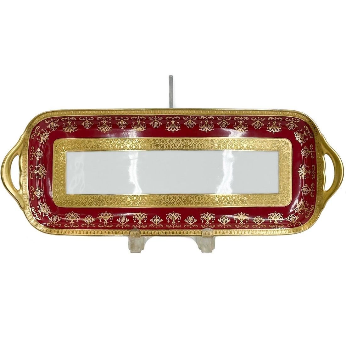 Raynaud Limoges France Gilt Porcelain Long Cake Plate in Eugenie Rouge: Raynaud Limoges France Gilt Porcelain Long Cake Plate in Eugenie Rouge. A burgundy red ground to the edge with ornate gilt decoration, raised accents. Underside marked Raynaud Limoges "Eugenie"From th