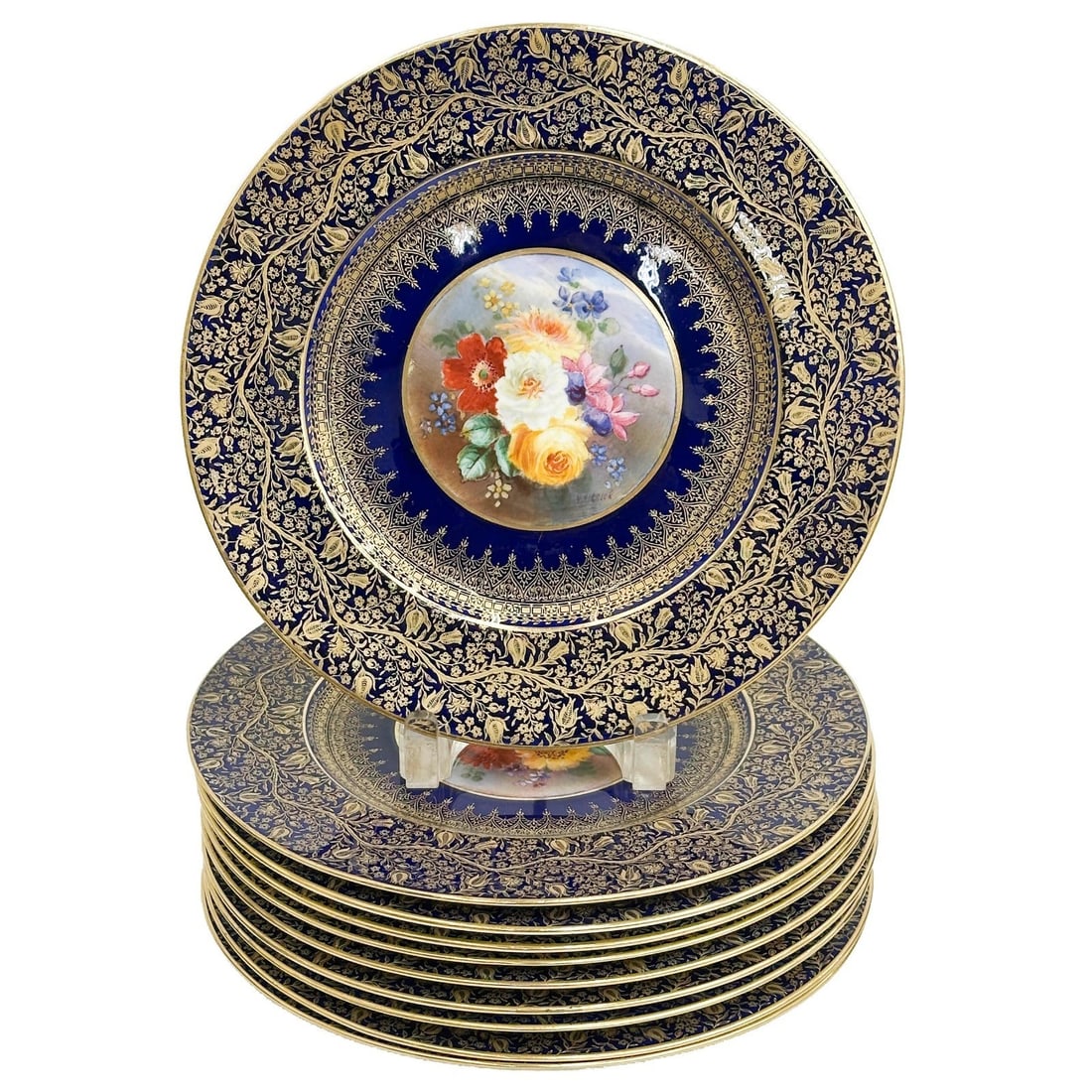 10 George Jones Crescent & Sons Porcelain Dinner Plates Signed Birbeck c1924: 10 George Jones Crescent & Sons Porcelain Dinner Plates. Hand painted florals to the center, a cobalt blue ground to the edge decorated with ornate gilt designs. Artist sighed to center edge W Birbeck