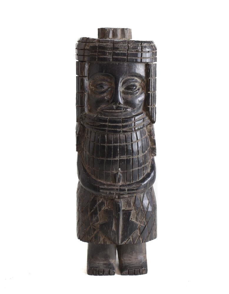 African Carved Wood Standing Guardian Figure with armor: African Carved Wood Standing Guardian Figure, Appears to be carved wearing a type of armor, and holding a staff or weapon. 4lbs Measurements: Approx. 10.5" height x 3.5" x 3". Condition: Condition com
