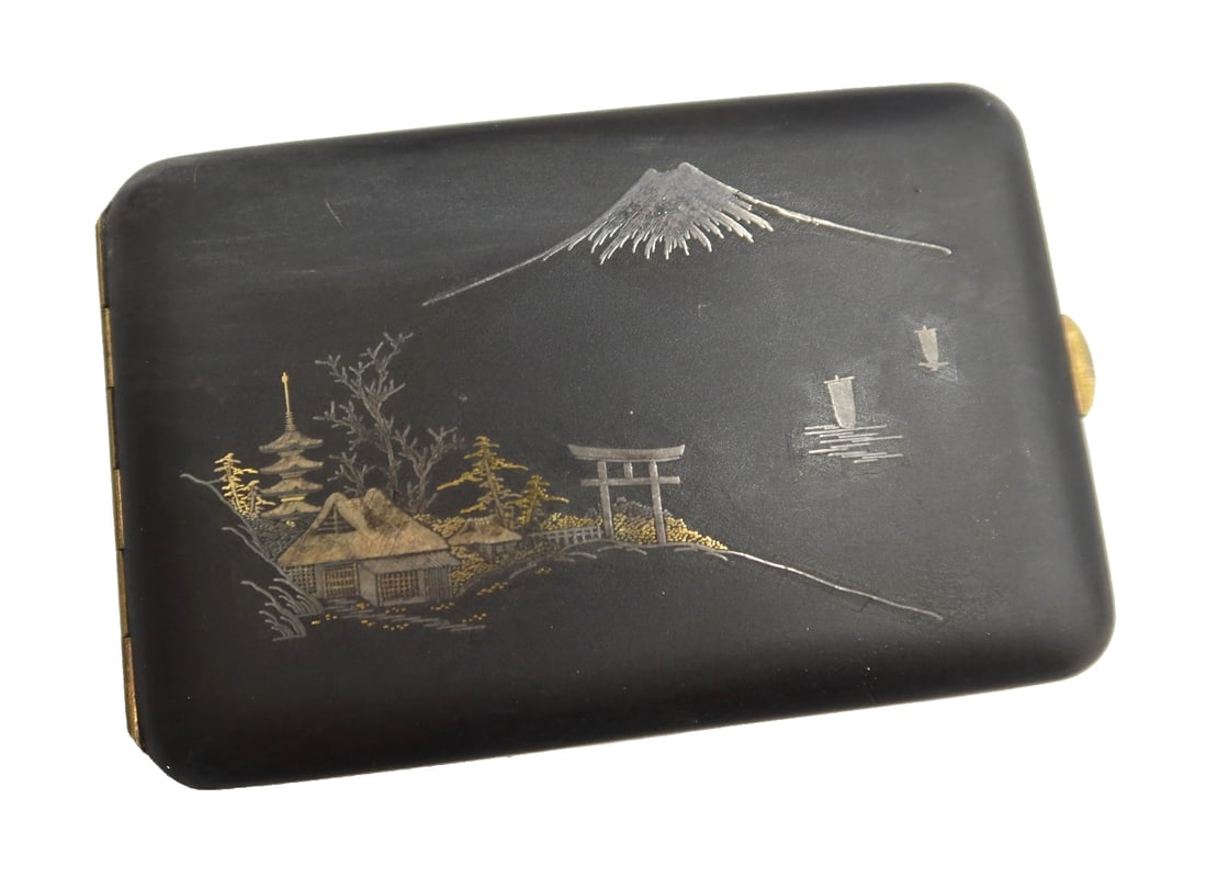 Japanese Mixed Metal Damascene Cigarette Case Mount Fuji 1st Half 20th C: Japanese mixed metal damascene cigarette case Mount Fuji, 1st Half 20th Century. Depicts a pagoda, shrine, boats on a lake, and Mount Fuji in the background. Marked "k24" to interior. Weight: Approx. 