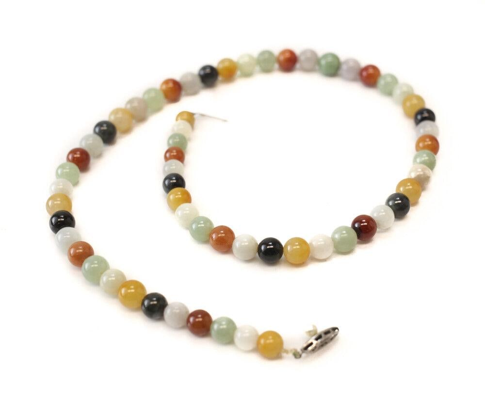 Multicolored Jadeite Beaded necklace with Sterling silver and pearl closure: Vintage Multicolored Jadeite Beaded necklace with Sterling silver and pearl closure, slightly graduated beads 10mm - 8mm. Clasp marked 'Silver'. 71.1grams Measurements: Approx. 21inches length. Condit