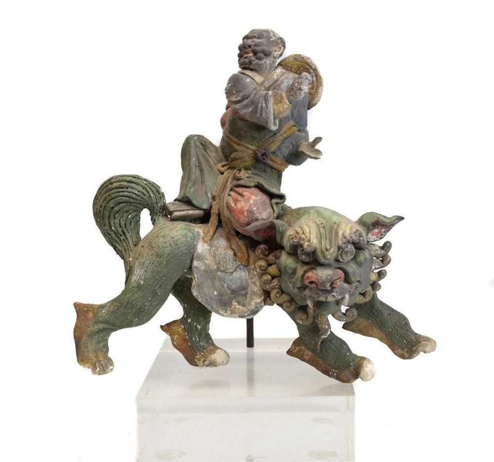 19th c Chinese Polychrome Stucco Roof Figure figure seated on a Dragon / Lion: 19th century Chinese Polychrome Stucco Glazed Roof Figure, figure seated on a Dragon / Lion / Qilin On metal and acrylic mount. 7.25Lbs Measurements: Approx. 10.25" height without base Condition: Age 