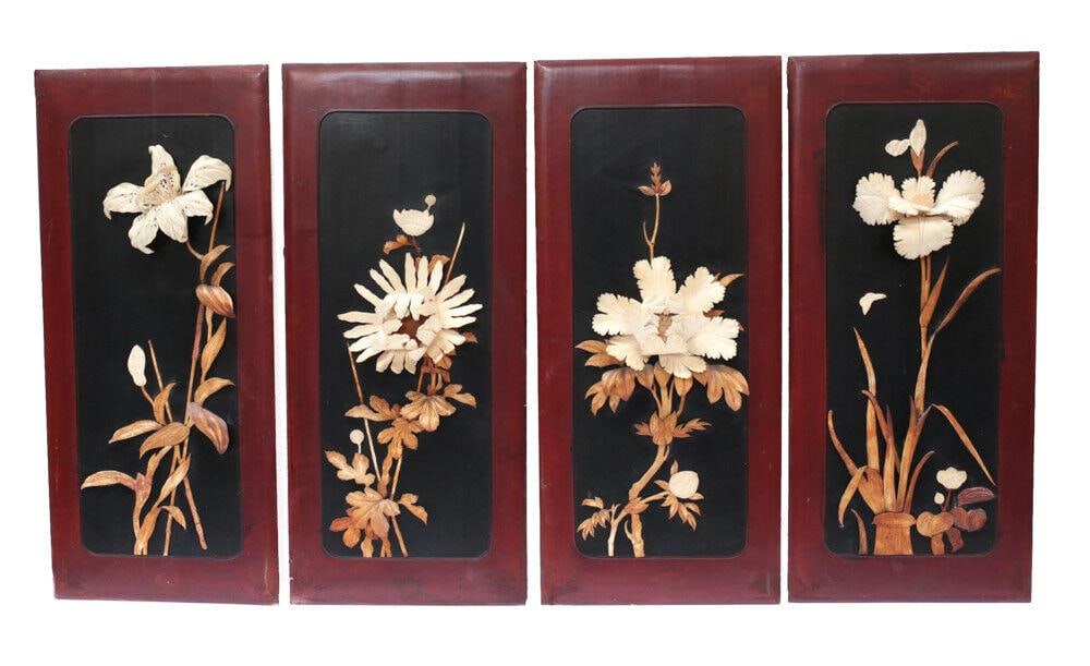 Set of 4 Japanese Floral Relief wall plaques hand carved late 19th century: Set of 4 Japanese Floral Relief wall plaques, hand carved, late 19th century. Graceful blooms and buds in high relief; the leaves and stems stained a darker amber color; on black lacquer, framed in re