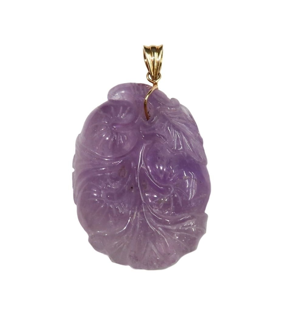 Gump's 14k Yellow Gold and Amethyst Carved Pendant: Gump's 14k Yellow Gold and Amethyst Carved Pendant. Carved birds and flowers to amethyst. Marked Gump's 14k to hook. Weight: Approx. 33.19 grams Measurements: Approx. 2.5 inches x 1.5 inches x 0.5 inc