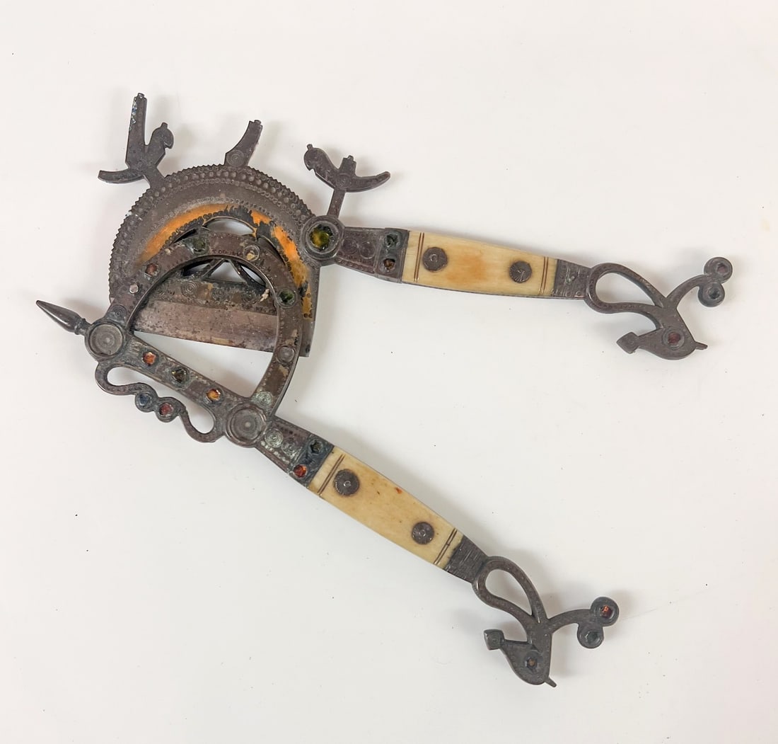 19th Century Areca Betel Nut cutter Sorota brass inlaid colored glass Srilanka: 19th Century Areca Betel Nut cutter Sorota, brass and inlaid colored glass, iron blade. Likely Sri Lankan Measurements: Approx. 7.875 x 3.75 inches Condition: Good condition, oxidation, some losses to