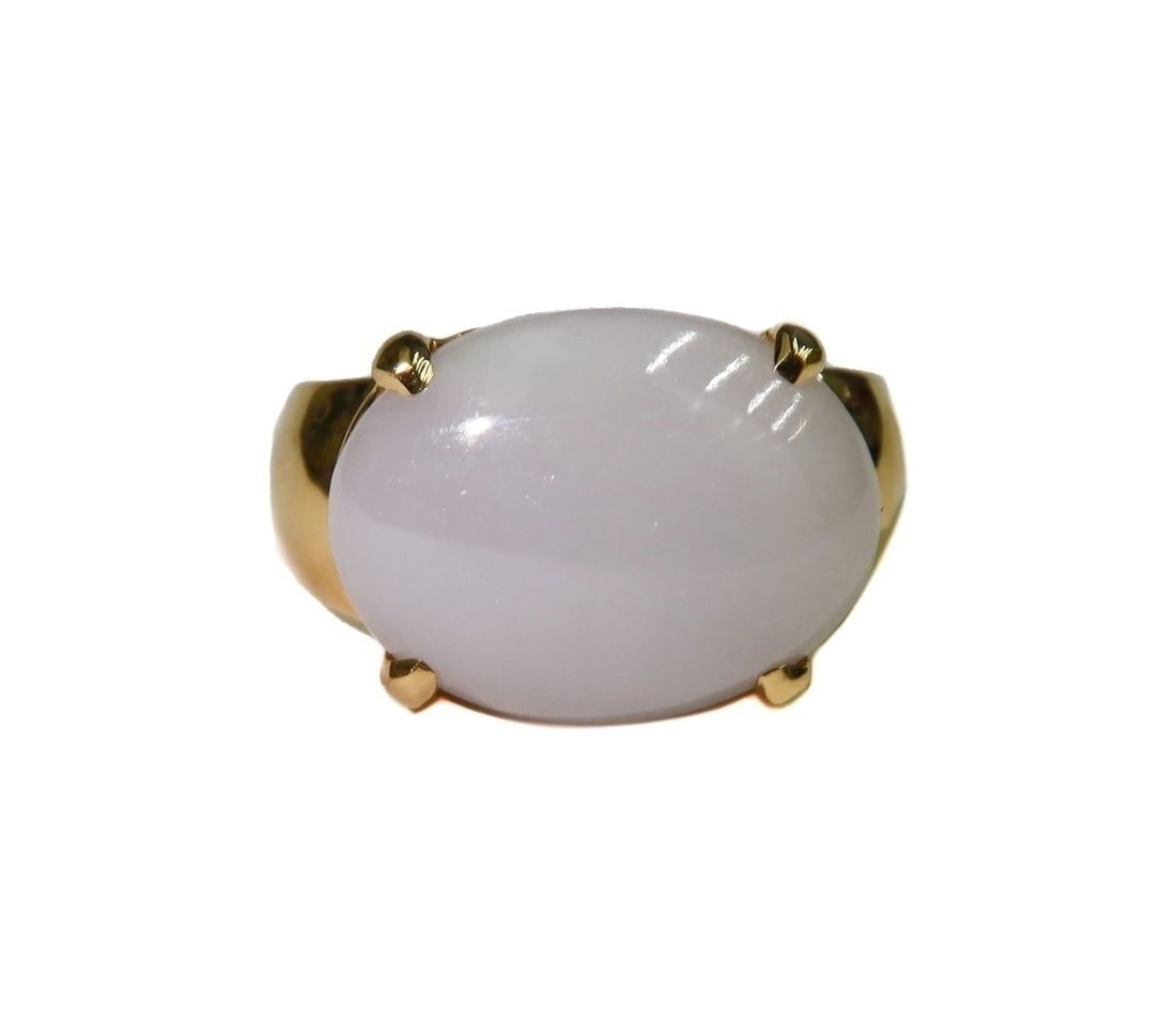 Gump's 18k Yellow Gold and Cabochon White Jade Ring Size 8.5: Gump's 18k Yellow Gold and Cabochon White Jade Ring Size 8.5. Cabochon white jade ring to center measuring approximately 16.2mm x 12.3mm x 6.1mm. Marked 18k Swiss. Weight: Approx. 9.79 grams Measureme