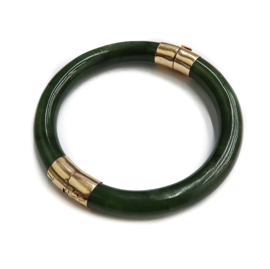 14k Yellow Gold Green Jade Bangle Bracelet: 14k Yellow Gold Green Jade Bangle Bracelet. Marked 14k to clasp. Weight: Approx. 46 grams Measurements: Approx. 7 inches circumference Condition: Great condition. Light surface wear. Domestic Shipping