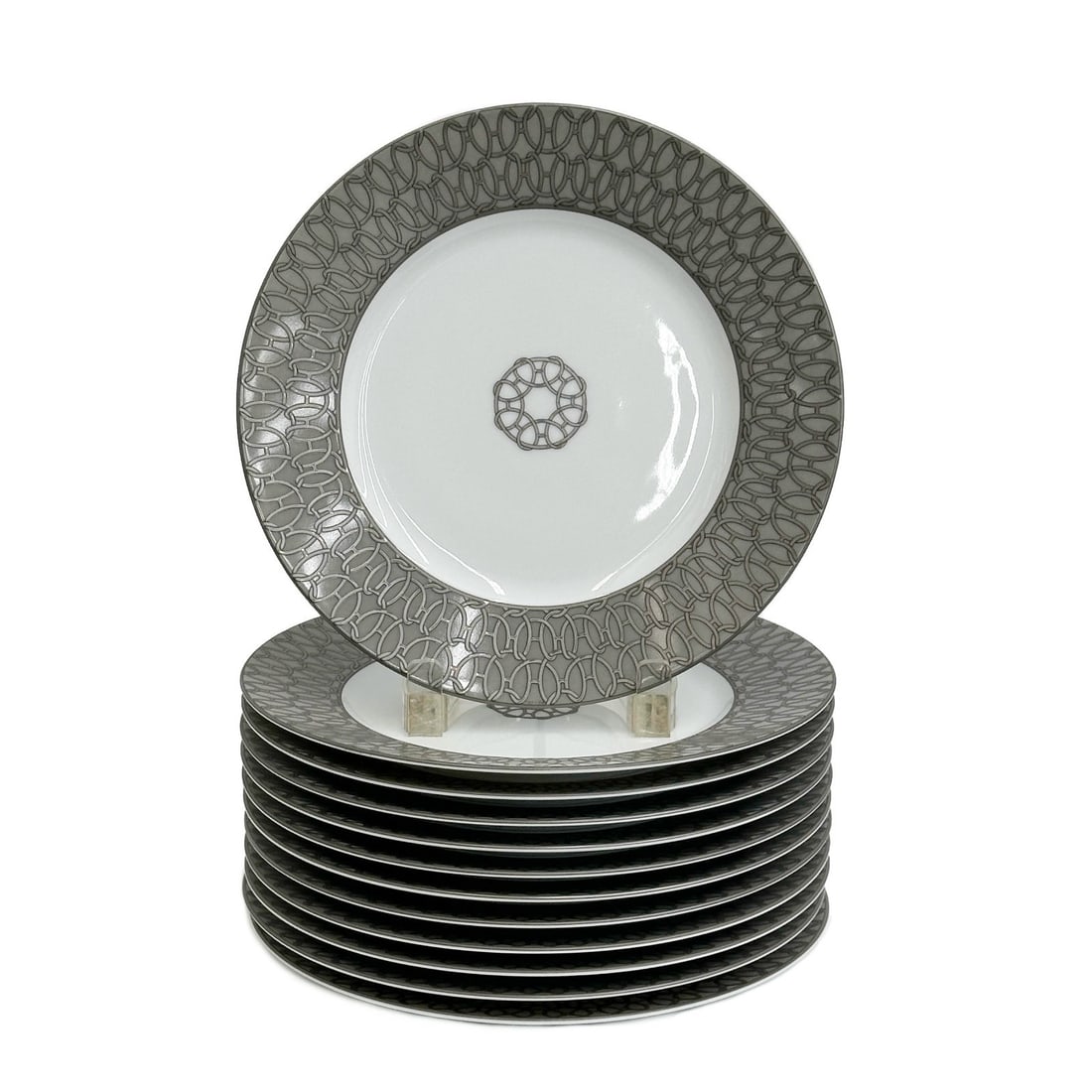 12 Hermes Paris Porcelain Fil d'Argent Silver Chains 8.8in Dessert Plates: 12 Hermes Paris Porcelain Dessert or Pie Plates in Fil d'Argent. Silver chain decoration to the edges, marked Hermes. Underside marked Hermes Porcelaine Fil d'Argent. Weight: Approx. 10.5 lb Measureme