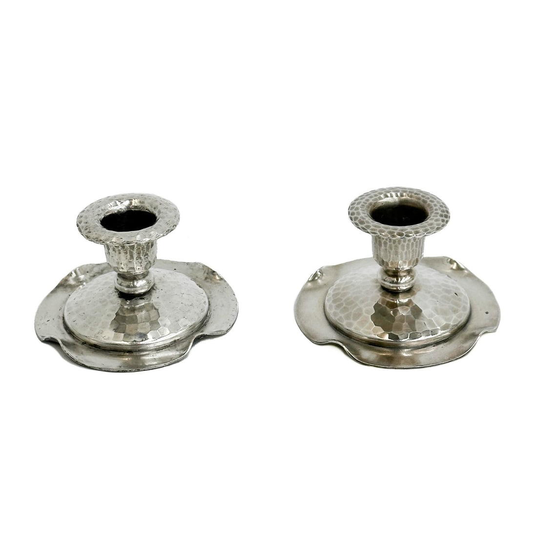 Pair Roycroft American Arts & Crafts Hammered Silver Plate Candlestick Holders: Pair Roycroft American Arts & Crafts Hand Hammered Silver Plate Candlestick Holders. Hand hammered silver plate finish, underside marked Roycroft. Weight: Approx. 1 lb Measurements: Approx. 3.625 inch