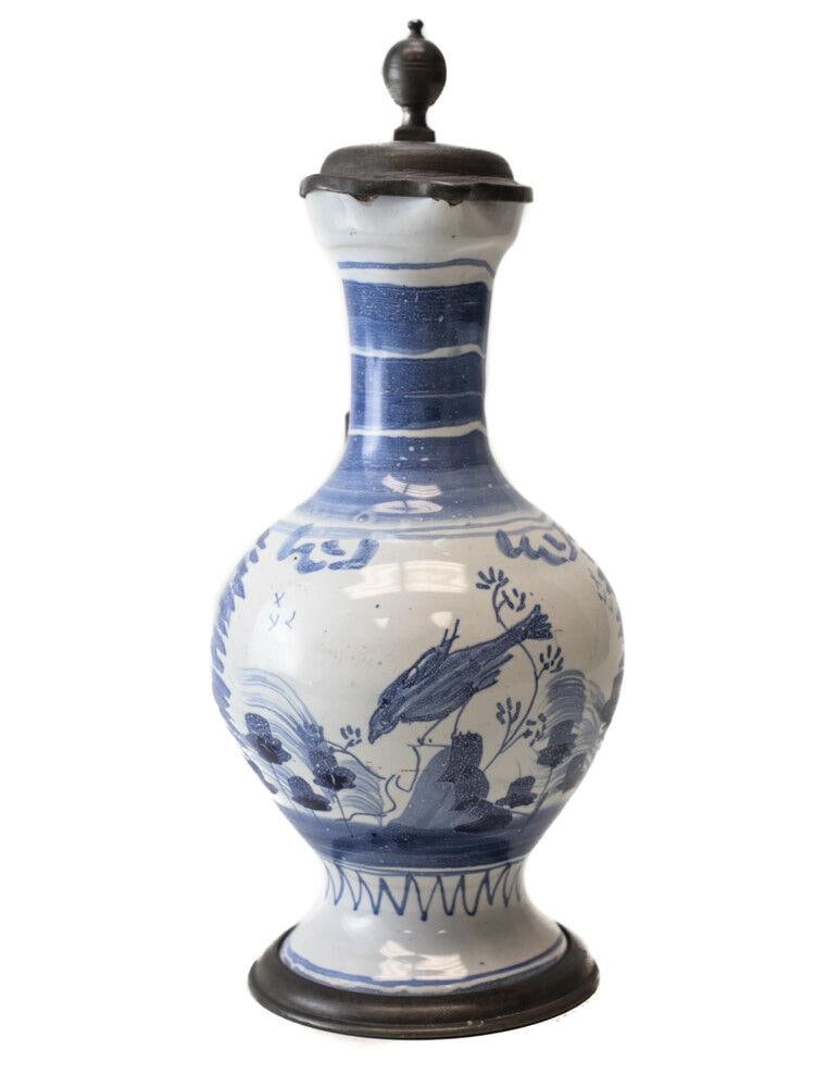 18th Century Pewter mounted Continental Faience Ewer Jug painted blue and white: 18th Century Pewter-mounted Continental Faience Ewer Jug, painted blue and white chinoisorie style landscape with bird. No hallmarks, or makers marks. From the estate of Hans Cohn. 1.25lbs From the es