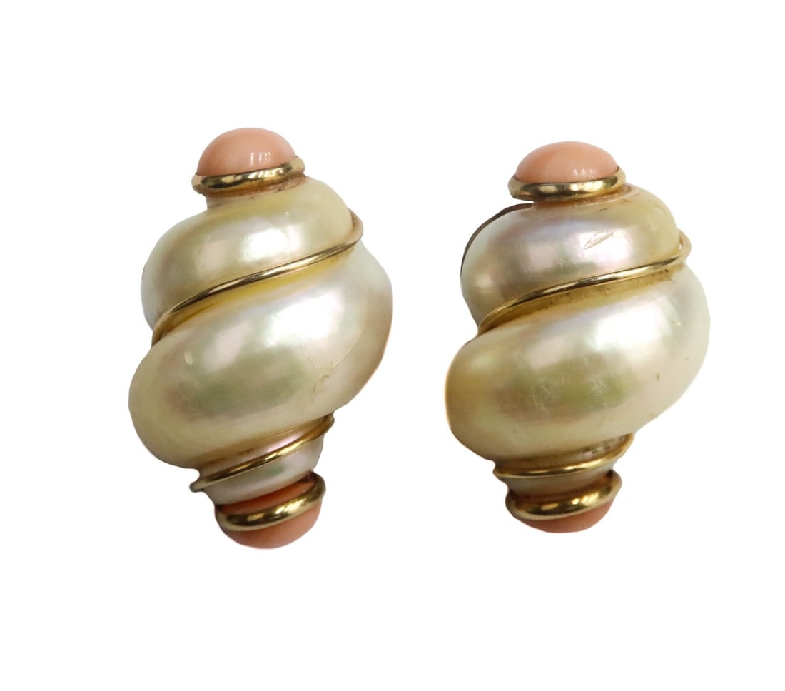 14k Yellow Gold Turbo Pearl Shell and Pink Coral Clip Earrings: 14k yellow gold turbo pearl shell and pink coral clip earrings. Turbo shell with round cabochon pink coral to both sides. Gold wire accenting the curve with an omega clip backing. Faintly marked 14k t