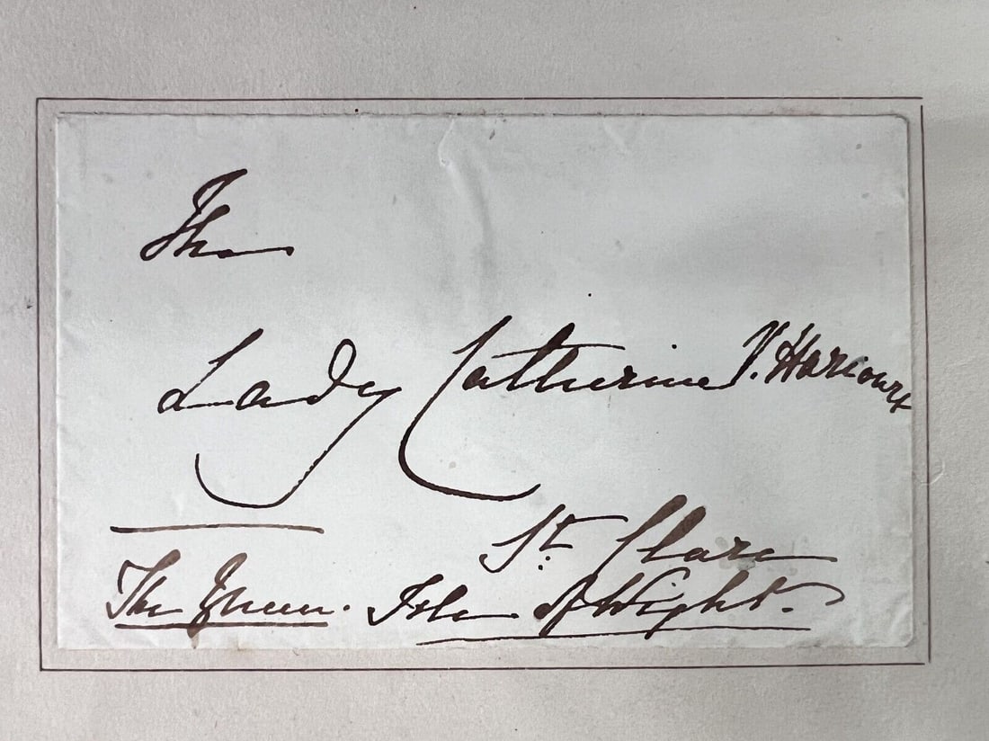 Queen Victoria Handwritten Autographed Envelope Lady Catherine Vernon-Harcourt: Queen Victoria (1819 - 1901)Hand addressed and signed envelope, addressed to Lady Catherine Vernon-Harcourt, St Clare, Isle of Wight (signed) "The Queen." mounted within a folio including an engraved 