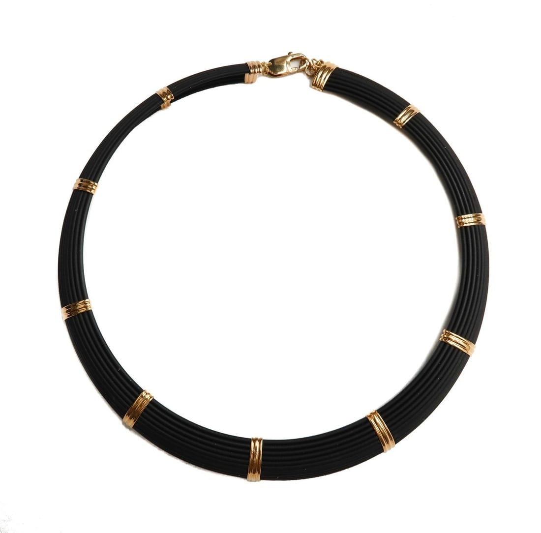 Roberto Coin Italian 18k and 14k Rose Gold Ruby and Rubber Choker Necklace: Roberto Coin Italian 18k and 14k rose gold ruby and rubber choker necklace. 11 rubber cords with rose gold stabilizer spacer bars. Marked 585 to lobster clasp. Marked 750 Italy with a ruby jewel to en