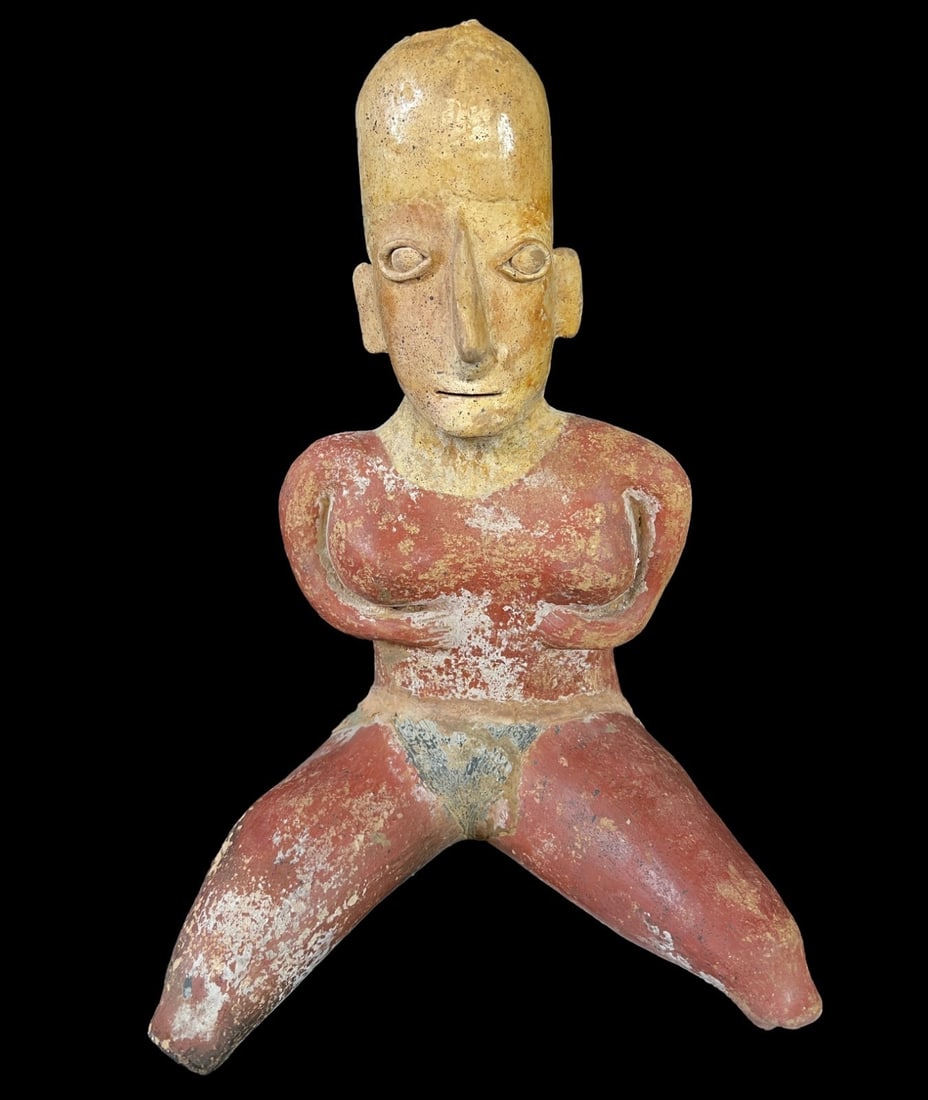 Precolumbian Seated female figure: Precolumbian Seated female figure, likely Jalisco, red slip with some black. Measurements: Approx. 15 x 11.25 x 8 inches Condition: Condition commensurate with age, some restorations about the waist a