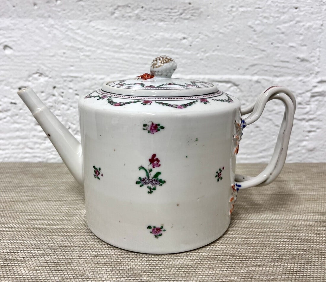 Chinese Export Tea Pot 19th Century: Chinese Export Tea Pot, cylindrical form, hand painted flowers, Strawberry form finial. Twist handle. Museum numbering on the bottom of the pot and lid. Approx 1.8lbs Measurements: Approx. 9.25 inches