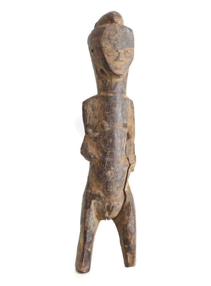 African Carved Wood Figure Dogon Crude form large head female: African Carved Wood Figure, Dogon Crude form, large head, female. 0.75lbs Measurements: Approx. 13" height. Condition: Condition commensurate with age, use. noteable age and wear, checking/cracks. As 
