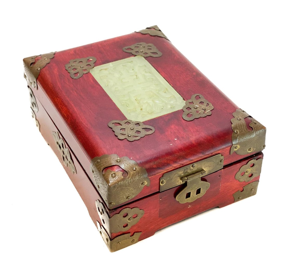 Vintage Chinese Red Lacquered Wood and Jade Jewelry Box: Vintage Chinese red lacquered wood and jade jewelry box. Jade emblem to the lid of the box. Red fabric and mirror to the interior. Gilt metal accents to the corners. Weight: Approx. 3 lbs Measurements