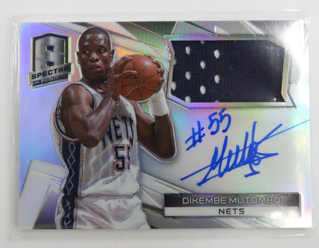2015 NBA Panini Spectra Dikembe Mutombo 2002-03 New Jersey Nets Autograph: 2015 NBA Panini Spectra Dikembe Mutombo 2002-03 New Jersey Nets Autograph Card No. 11008/100 Condition: Please refer to images. Domestic Shipping:$30