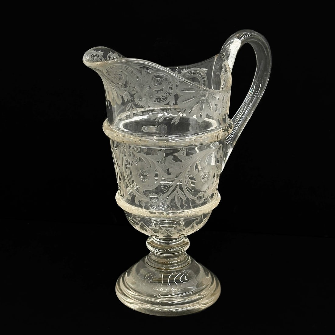 Bohemian Engraved Glass Pitcher 19th century: Bohemian Engraved Glass Pitcher, 19th century. Floral decoration throughout, apparently unmarked. Weight: Approx. 3 lb Measurements: Approx. 8.25 inches x 4.75 inches x 10.25 inches tall Condition: Re