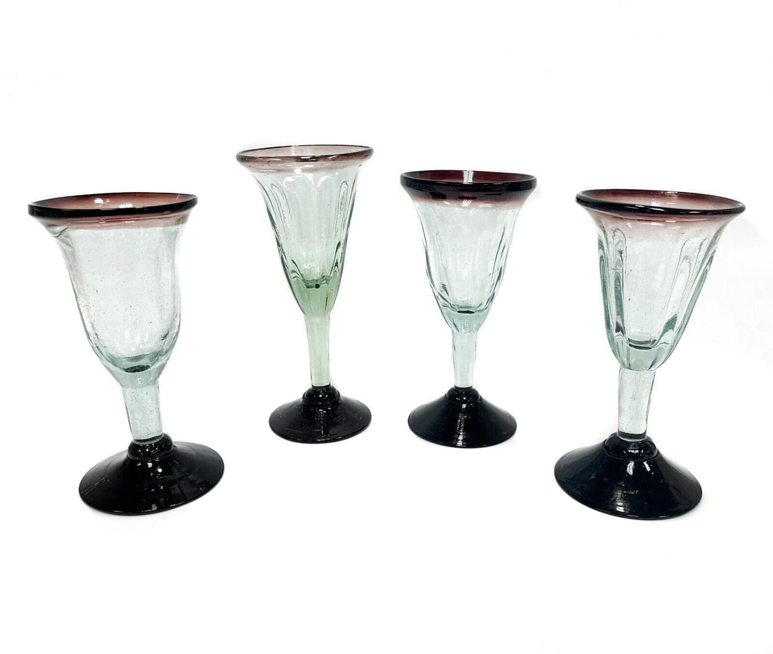 4 Italian Hand Blown Green and Amethyst Glass Fluted Wine Goblets, Mid Century: 4 Italian hand blown fluted wine goblets, Mid Century. Faint green blue to the body with amethyst to the rims and bases. Rough pontils to the underside base. Weight: Approx. 4 lbs Measurements: Approx