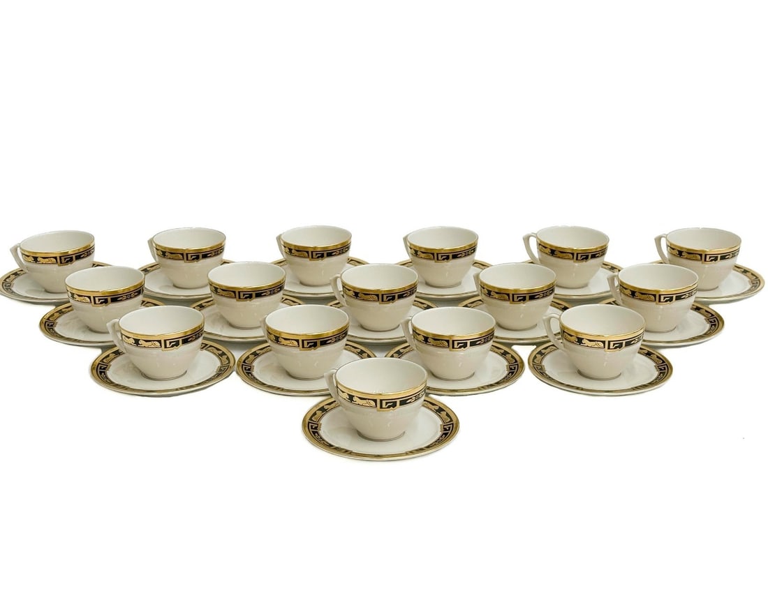 16 Cartier France La Maison de L'Art Deco Panther Gilt Porcelain Cup & Saucers: 16 Cartier France La Maison de L'Art Deco Gilt Porcelain Cup & Saucers. A white ground with gilt decoration to rim and center of panthers with blue enamel jewel accents. Underside marked Cartier La Ma