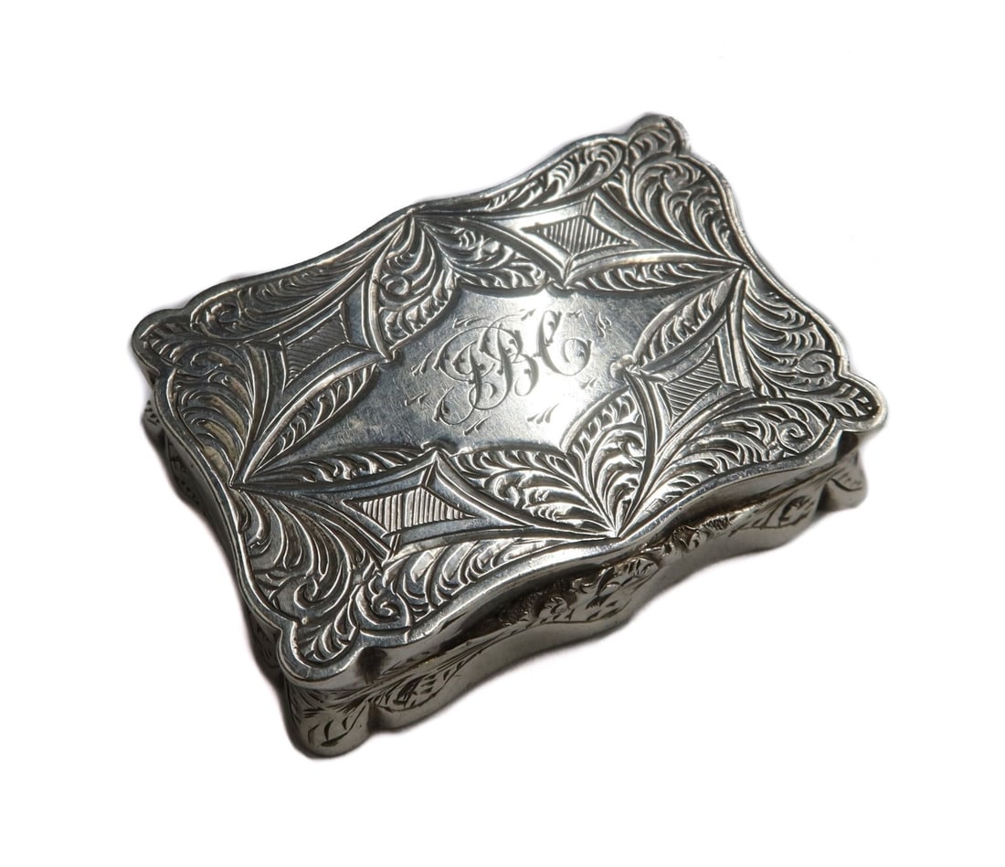 Alfred Taylor Birmingham Sterling Silver Vinaigrette Box 1866: Alfred Taylor Birmingham sterling silver vinaigrette box, 1866. Slightly scalloped edge with engraved scrolls and geometric throughout. 3 letter monogram to center. Alfred Taylor silver hallmarks to t