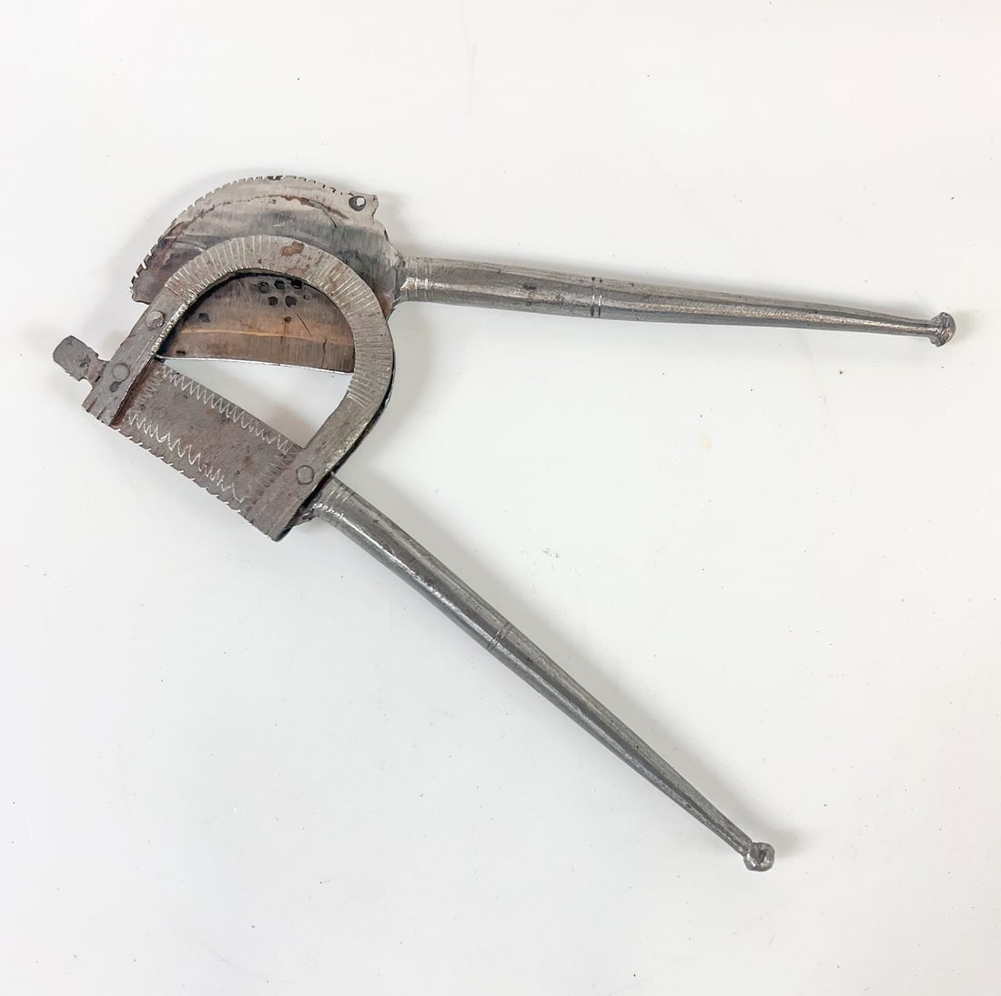 19th Century Iron Areca Betel Nut cutter Sorota: 19th Century Iron Areca Betel Nut cutter Sorota. Serrated top and bottom. Pierced holes. Measurements: Approx. 7.5 x 2.5 Condition: Good condition, some oxidation. Domestic Shipping:$40
