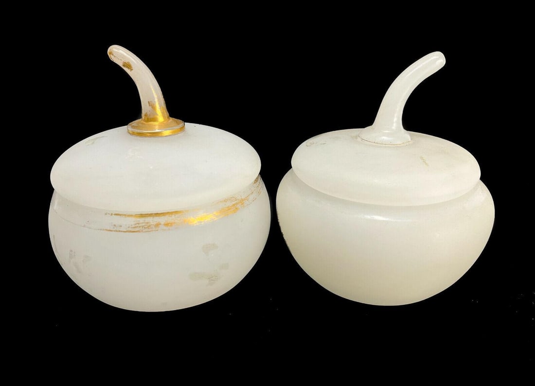 Pair White Opalescent Glass and Gilt Apple Lidded Jars or Boxes, circa 1940: Pair White Opalescent glass and gilt apple lidded jars or boxes, circa 1940. Gilt to the circular bands and finials. Unmarked. Weight: Approx. 1 lb Measurements: Approx.larger one: 4.5 inches diameter