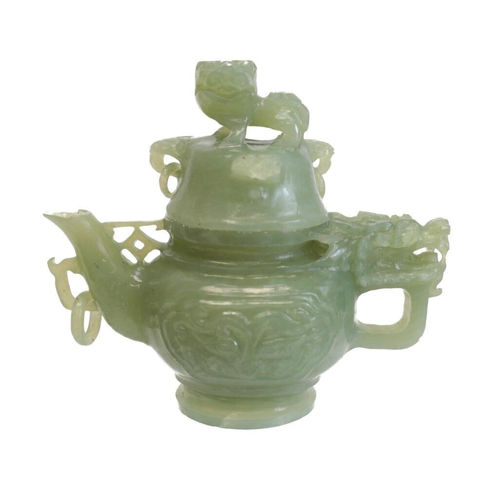 Jade Carved Dragon Head Teapot, guardian lion finial, and dragon head: Jade Carved Dragon Head Teapot, guardian lion finial, and dragon head at the handle. Loose rings on lid and spout. 1.25lb Measurements: Approx. 4.75" height x 5.75" spout to handle. Condition: Good co