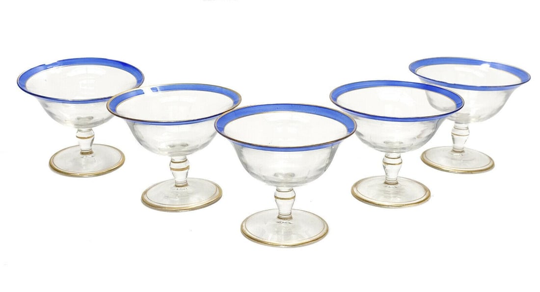 5 American Glass Footed Sherbet Compotes, circa 1940. Clear Blue and Gold: 5 American glass footed sherbet compotes, circa 1940. Clear with a blue edge and gilt accents. Weight: Approx. 2 lbs Measurements: Approx. 4.25 inches diameter x 3.5 inches tall Condition: Great condi