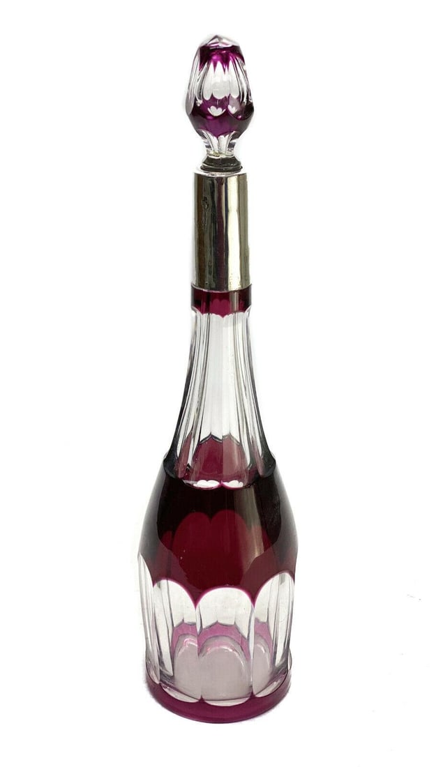 French Wine Red Cut to Clear & Silver Overlay Decanter: French wine red cut to clear & silver overlay decanter. Cut panels to the neck. Silver overlay to the neck marked 80. Unmarked, but likely French- possibly Baccarat or Saint Louis. Weight: Approx. 3 l
