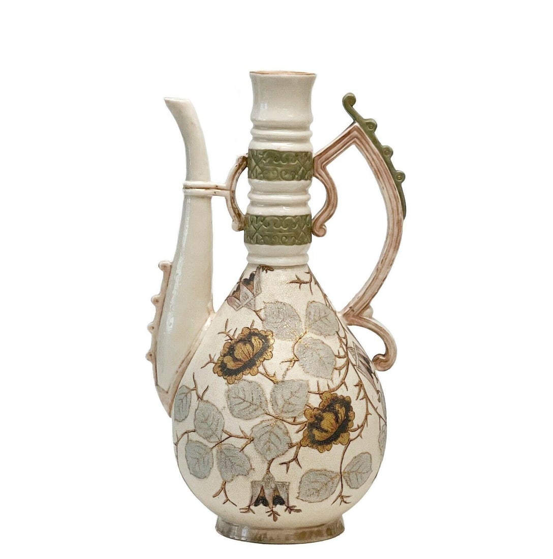 Royal Rudolstadt Germany Pottery Hand Painted Porcelain Ewer circa 1910: Royal Rudolstadt Germany hand painted ewer, circa 1910. Body with a porous tapestry finish, decorated with gilt and blue leaves and flowers. Bands of green to the neck. With Royal Rudolstadt crown mar