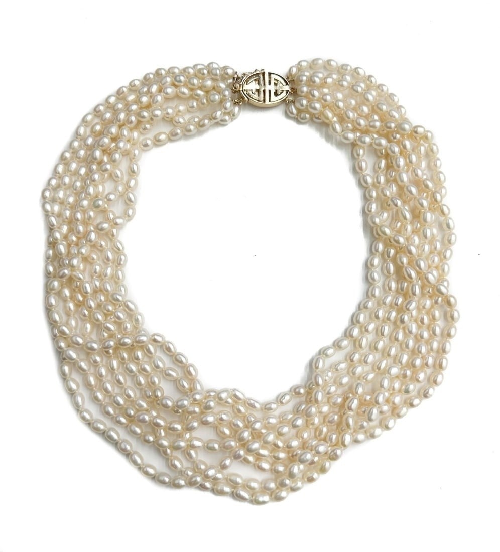 Gump's 14k Yellow Gold and Cultured Pearl 8 Strand Necklace: Gump's 14k Yellow Gold and Cultured Pearl 8 Strand Necklace. Oval cultured pearls measuring approximately 5.5mm x 4.42mm. Marked Gump's 14k to clasp. Weight: Approx.89.4 grams Measurements: Approx. 17