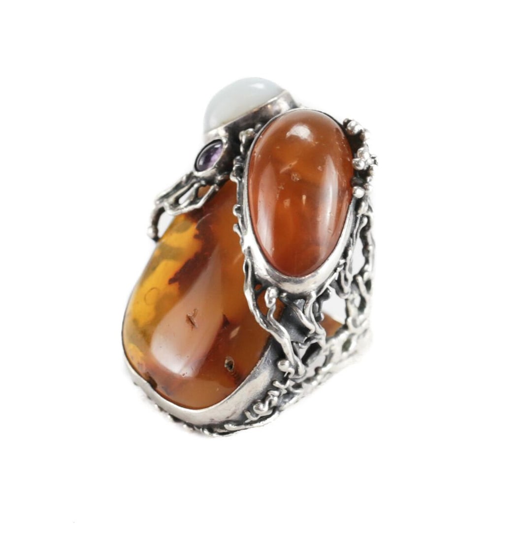HUGE Ciro Baltic Amber Amethyst White jade Sterling Silver Artisan Ring sz 7.25: Stunning and dramatic Baltic Amber, Amethyst and White jadeite Sterling Silver Artisan Ring size 7.25. Large asymmetrical stone flanked by smaller stone cabochons. Branching tendril setting. Marked 93