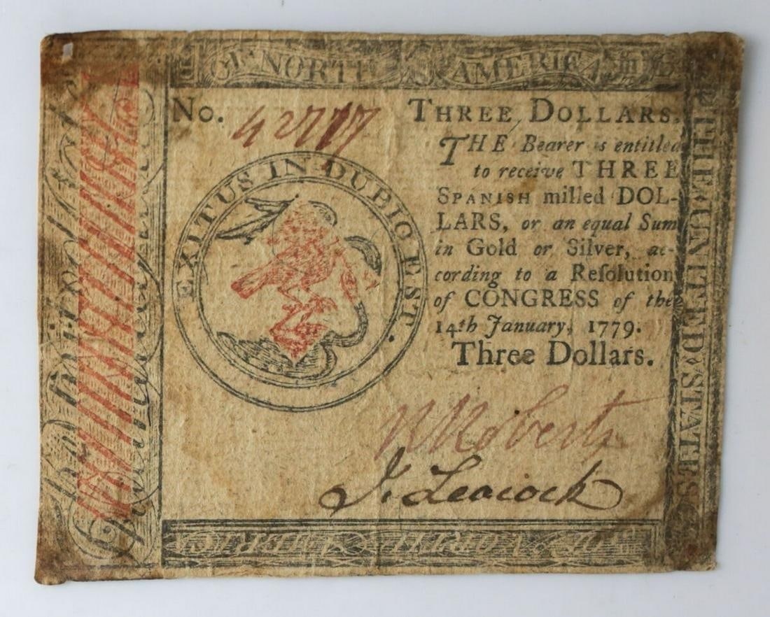 $3 US Continental Currency January 14, 1779: US of North America Continental Currency $3 Three Spanish Milled Dollars January 14, 1779. Serial 4....(illegible). Signed R. Roberts, John Leacock (face). Blue fibers and mica flakes in paper. Printe