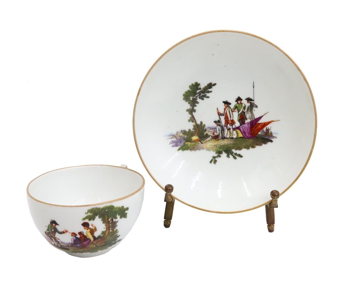 Meissen Germany Hand Painted Porcelain Cup and Saucer Soldiers 1784: Meissen Germany hand painted porcelain cup and saucer soldiers 1784. Meissen mark to underside. Weight: Approx. 1 lbs Measurements: Approx. Cup: 4 inches x 3.125 inches x 1.9 inches tall / Saucer: 5.2