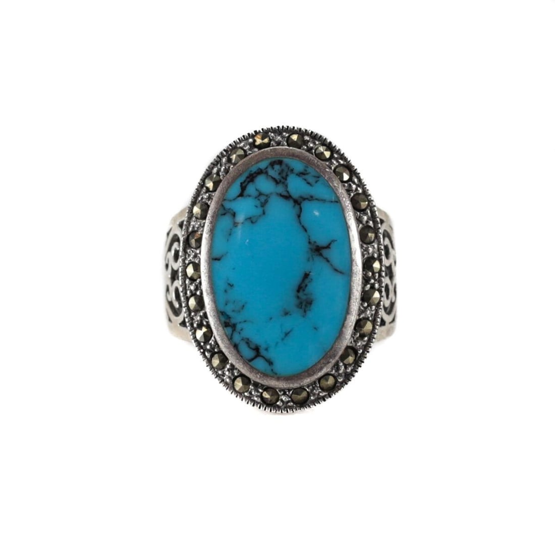 Vintage Large Sterling Silver Turquoise Marcasite Ring Size 7.5 flush mounted: Vintage Sterling Silver Turquoise Marcasite Ring, Size 7.5. Lovely flat inlayed sky blue oval gemstone, framed by marcasite. Openwork scrolls on the band. Marked 925, and the letter R. 9.7grams Measur