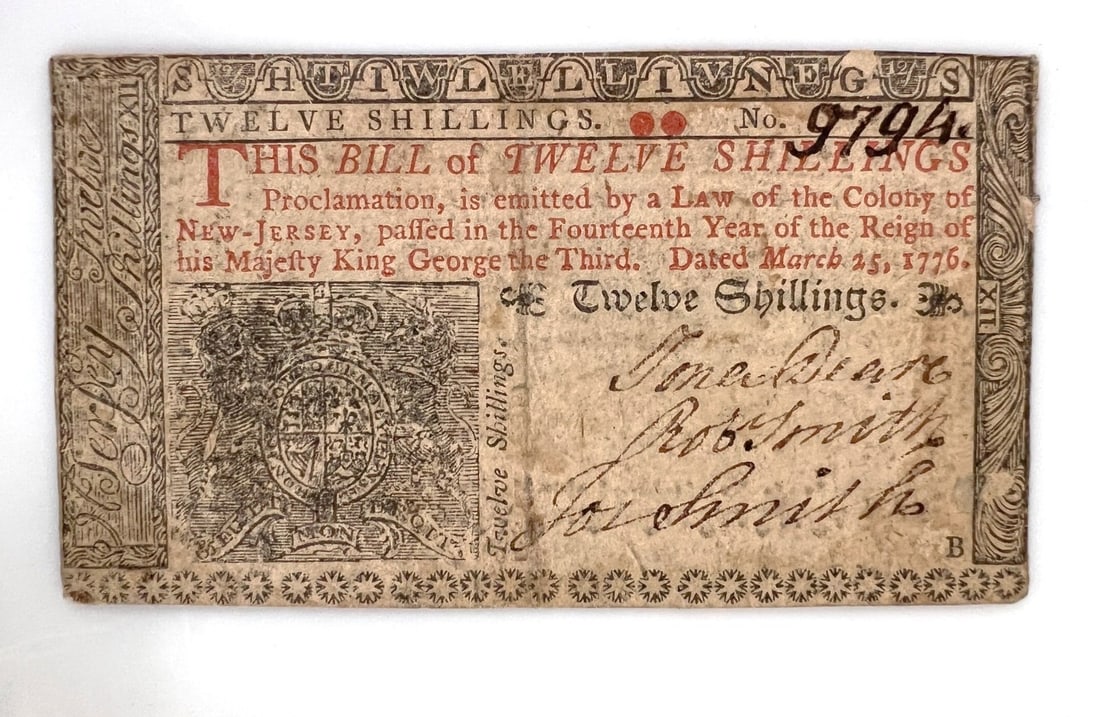 New Jersey Colonial Currency 12 Twelve Shillings March 25, 1776: New Jersey Colonial Currency 12 Twelve Shillings March 25, 1776. Serial 9794. Signed Jonathan Deare, Rob (Robert) Smith, Jos. (Joseph) Smith. Mica flakes in paper. Printed by Issac Collins, 1776. Very