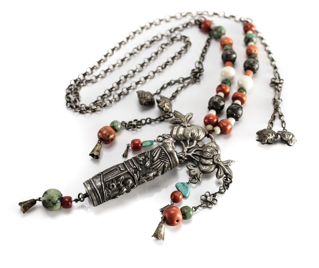 19th century Tibetan Sterling Silver Beaded Necklace coral jade turquoise: c19th century Tibetan Sterling Silver Beaded Necklace, coral, white and green jade, coral, turquoise. Raised figures on central cylindrical piece, bells, floral details. 4.25ozt Measurements: Approx. 