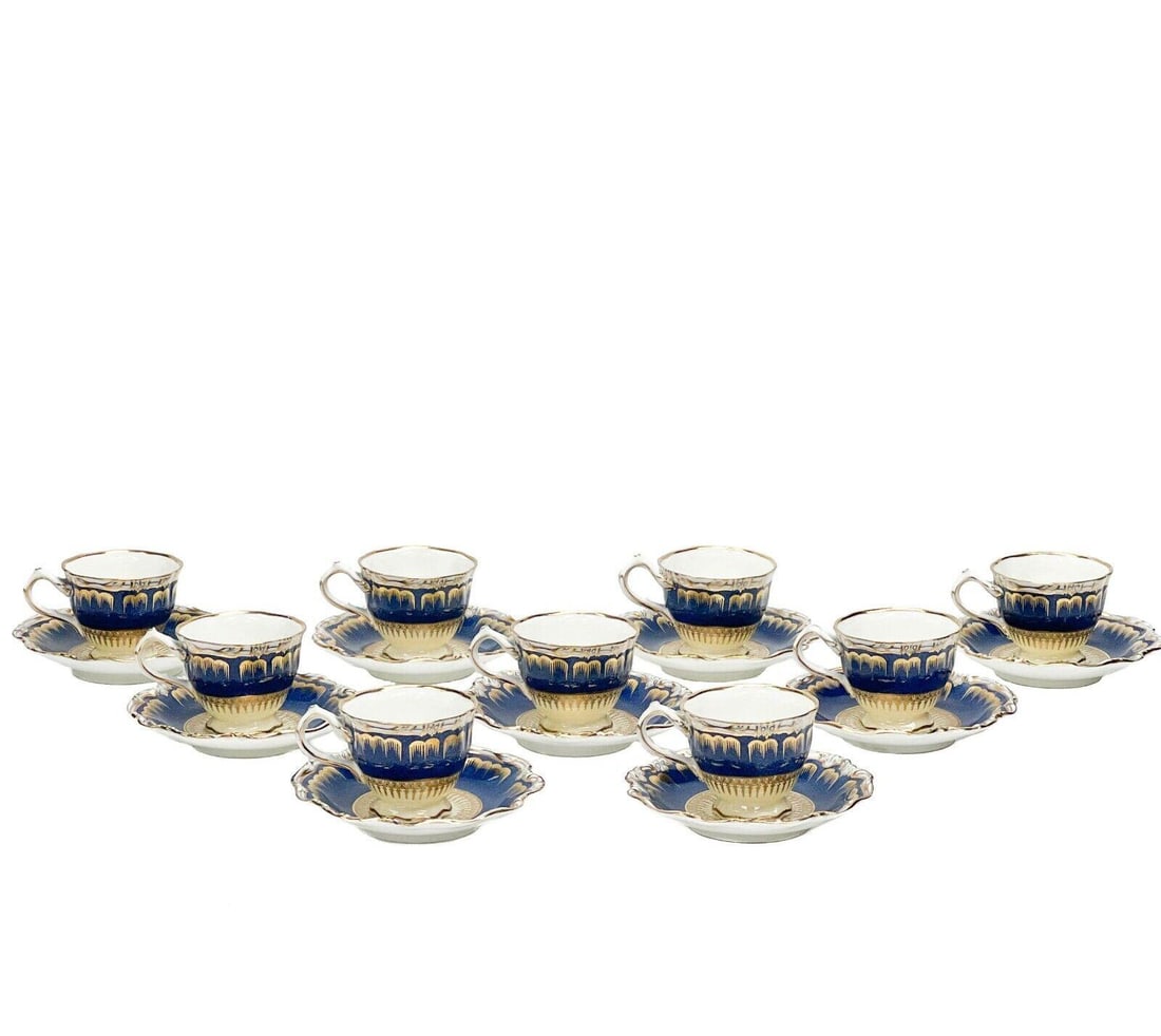 9 George Jones & Sons Crescent Hand Decorated Porcelain Demitasse Cup & Saucers: 9 George Jones & Sons Crescent hand decorated porcelain demitasse cup & saucers, circa 1910. A blue ground to the ruffled edge with scalloped gilt decoration. An off-white ground to center with colorf
